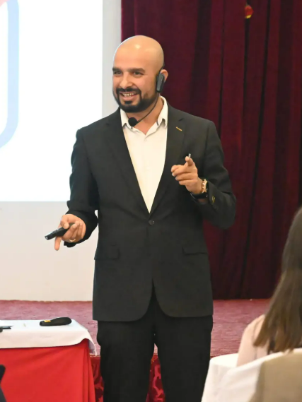 Motivational speaker in Nepal addressing employees at a corporate event